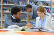 © auremar - young people studying at a table in the library