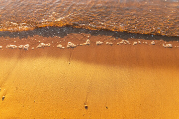 Wall Mural - Soft wave of the sea on the sandy beach.