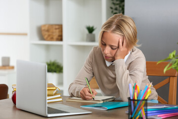 Sticker - Little boy doing homework in kitchen