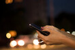 © Jelena - Close View of Female Hand Holding Smart Phone During Night