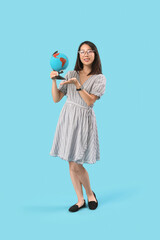 Poster - Asian Geography teacher with globe on blue background