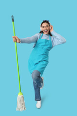 Poster - Pretty woman with mop and headphones listening to music on blue background