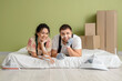 © Pixel-Shot - Beautiful young happy couple resting while doing repair in their new house