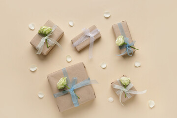 Wall Mural - Gift boxes with beautiful white roses and petals on beige background. International Women's Day