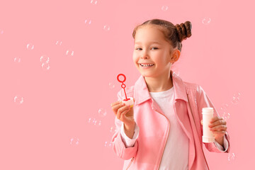 Sticker - Cute little girl with soap bubbles on pink background