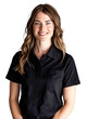 © LorenaPh - Caucasian woman in her 30s wearing a black polo shirt, smiling confidently against a transparent background.