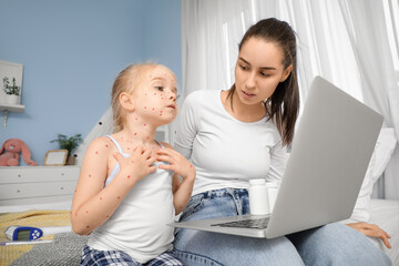 Sticker - Little girl ill with chickenpox and her mother video chatting in bedroom