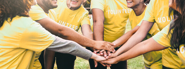 Volunteer, Team people stacking hands celebrating together. Charity and environmental community project