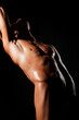 © Volodymyr - Muscular man on black background. Nude sexy male model. Naked sexy model with muscular body. Sexy male model body, nude torso. Sexy naked man, seductive gay. Muscular shirtless man, attractive guy.