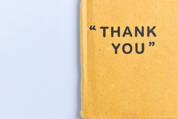 thank you wording on cardboard box texture on white background