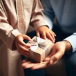 © Putra_hl - a child's hand giving a gift to his father. view from side. close-up style