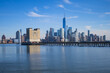 © Volodymyr - The city skyline of New York City in USA, United States. Blue sky day with iconic buildings. New York City NYC Manhattan Downtown Skyline, viewed from Jersey City, USA.
