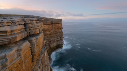 Canvas Print - Dramatic coastal cliffs overlooking serene ocean at sunset