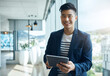 © Penn/peopleimages.com - Business, portrait and Asian man at window with tablet for email, report or review for web consultant. Smile, scroll and businessman on digital app for networking, search or planning office schedule
