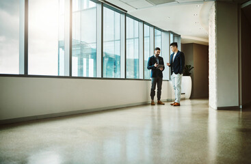 Aufkleber - Office, consulting and men in hallway together with tablet, planning and networking collaboration. Discussion, partnership and business people at window on digital app for project management advice