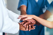 © Hira/peopleimages.com - Hands, diversity and teamwork medical support, staff and healthcare with nurse and doctors. Colleagues, collaboration and clinic for surgeon, medicine and partnership for help and unity in medicare