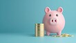 © Jrprr - piggy bank with coins on blue background