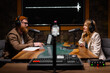 © Big Shot Theory - Joyful young stylish radio show hosts record fresh podcast episode in loft studio