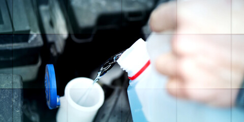 Wall Mural - Hands of mechanic pouring windshield washer fluid in a car, geometric pattern