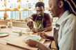 © zinkevych - Two people working with clay on a pottery workshop