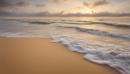 Wall Mural - Tranquil beach scene with foamy waves lapping at the sandy shore as the sun rises over the horizon, creating a serene and picturesque landscape.