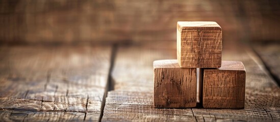 A wooden background with two wooden blocks displaying text, perfect for use as a copy space image.