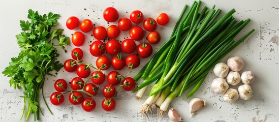 A variety of fresh ingredients like cherry tomatoes, green onions, garlic, and parsley on a clean white surface; seen from above with room for text or a logo. Copy space image