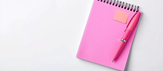 Poster - Top view of pink pen, sticky note, and notebook paper on white background with copy space image.
