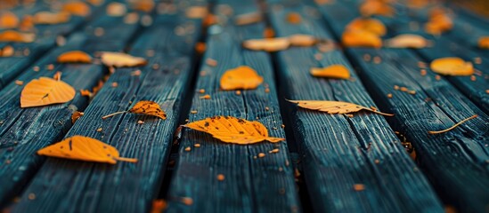 Aufkleber - A conceptual photo with a wooden table showcasing yellow tree leaves, symbolizing the changing season to autumn, with selective focus and copy space image.