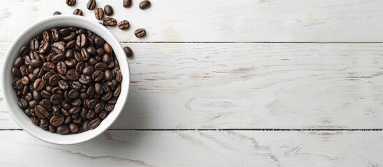 Wall Mural - Coffee beans in bowl with coffee maker on a wooden surface, set against a white paper background in the copy space image.