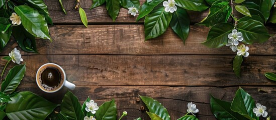 Aufkleber - Coffee mug surrounded by green leaves and flowers on a rustic wooden backdrop, perfect for a cover or card design with ample copy space image.