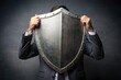 © Jason - business man raise shield to protect. Insurance and protection concept