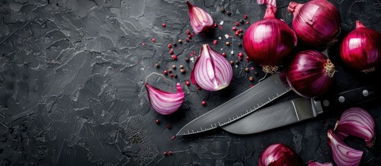 Sticker - Red and sliced red onions with a knife on a black background in a flat lay style with room for text or other elements in the image. Copy space image. Place for adding text and design