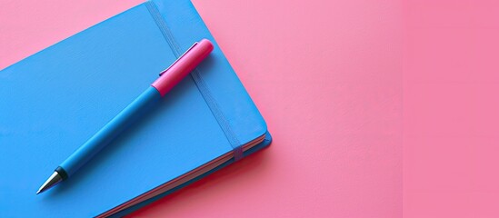 Aufkleber - Blue notebook and pen on a pink background with a theme of business, recreation, and planning, perfect for a copy space image.