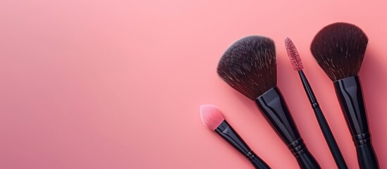 Poster - Glamorous makeup brushes displayed on a soft pink backdrop in a cosmetics store banner, showing visagist tools from a top view with a creative flat lay and copy space image.