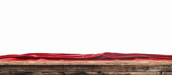 Wall Mural - Brown wooden table covered with a red tablecloth, isolated on a white background, with copy space image.