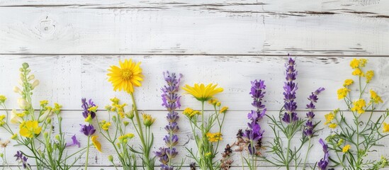Poster - A white wooden table adorned with yellow and purple flowers, providing ample copy space image.