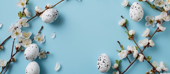 Aufkleber - Minimal Easter concept featuring a composition of Easter eggs and flower blossoms on a blue background with copy space image.