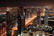© Travel 'n' Lifestyle - View of vibrant metropolitan cityscape with skyscrapers and illuminated lights, Dubai, United Arab Emirates.
