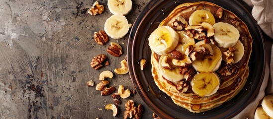 Sticker - Walnut and banana pancakes displayed on a table with copy space image.