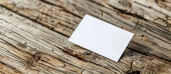 Leinwandbilder - Close-up shot of a white business card on a wooden surface, suitable for branding, with available copy space image for customization.