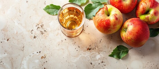 Poster - Apple cider displayed in a glass on a terrazzo countertop with a blank space for additional content in the image.