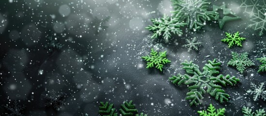 Unique Christmas-themed background featuring green snowflakes against a dark grey backdrop with space for text or images. Copy space image. Place for adding text and design