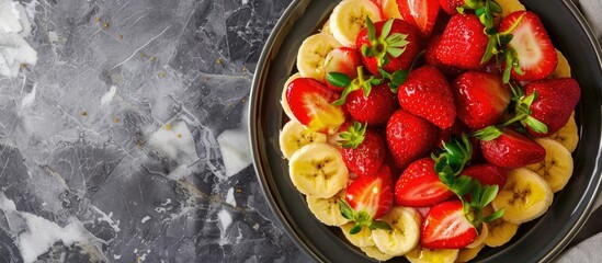 Poster - Strawberry dessert with fresh banana on a marble background features a copy space image.