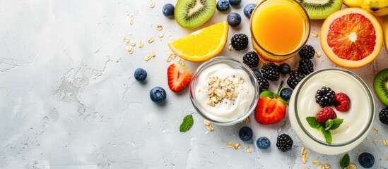 Aufkleber - A healthy breakfast concept featuring yogurt, fruits, fresh juice, and coffee with copy space image.