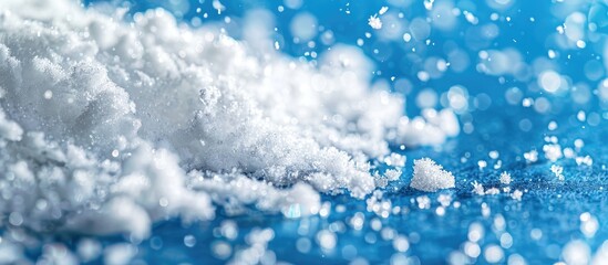 Poster - Close-up of white snow on a blue backdrop with space for text. Copy space image. Place for adding text and design
