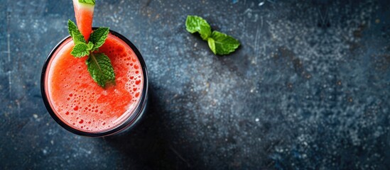 Aufkleber - Top view of a glass of watermelon smoothie on a dark table with ample copy space image.