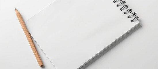 Fototapete - A blank white notepad close-up on a white background, providing template with copy space image for your text.