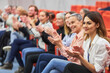 © Robert Kneschke - Audience clapping during business event in convention center