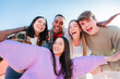 © Jose Calsina - Group of real multiracial teenagers having fun together and posing for a portrait. Young friends smiling and laughing. Multiethnic people bonding outside with positive and friendly expression